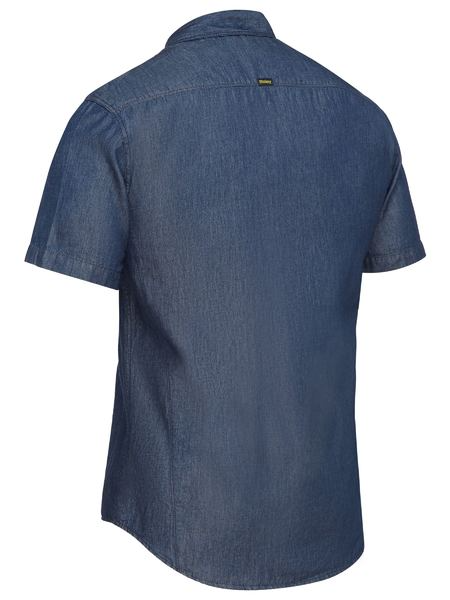 A collared and short sleeved denim work shirt with two chest pockets including one pen division pocket on the left side. Comes in a light and airy cotton fabric and button down closure.