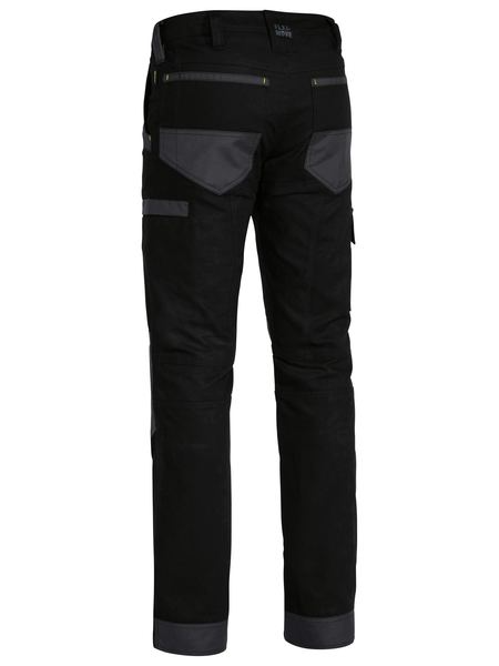 A black coloured work pant for men with a curved waistband. It has several multifunctional pockets with oxford patches. Made up of a mix of cotton, polyester and spandex for ultimate comfort and stretch.