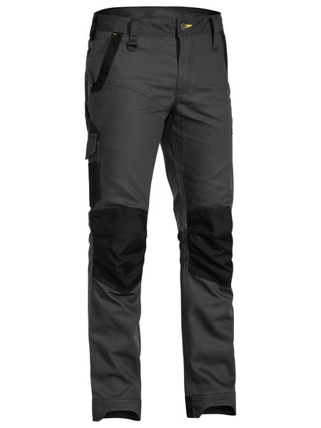 A charcoal coloured work pant for men with a curved waistband. It has several multifunctional pockets with oxford patches. Made up of a mix of cotton, polyester and spandex for ultimate comfort and stretch.