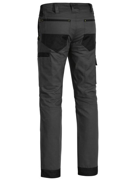 A charcoal coloured work pant for men with a curved waistband. It has several multifunctional pockets with oxford patches. Made up of a mix of cotton, polyester and spandex for ultimate comfort and stretch.