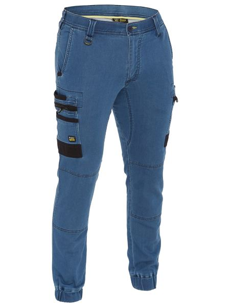 A light denim cargo work pants for men with a drawcord waistband. It has several multifunctional pockets with seven strong loops. Made up of a mix of cotton, polyester and spandex for maximum stretch and comfort.