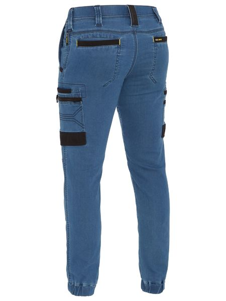 A light denim cargo work pants for men with a drawcord waistband. It has several multifunctional pockets with seven strong loops. Made up of a mix of cotton, polyester and spandex for maximum stretch and comfort.